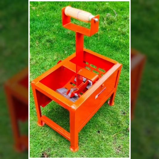 Orange peanut shelling machine with a steel net on a grassy lawn