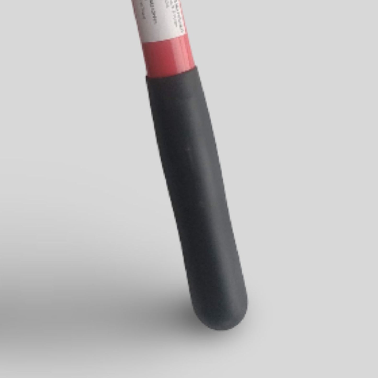Pruning lopper black soft grip with a red handle on a light gray background