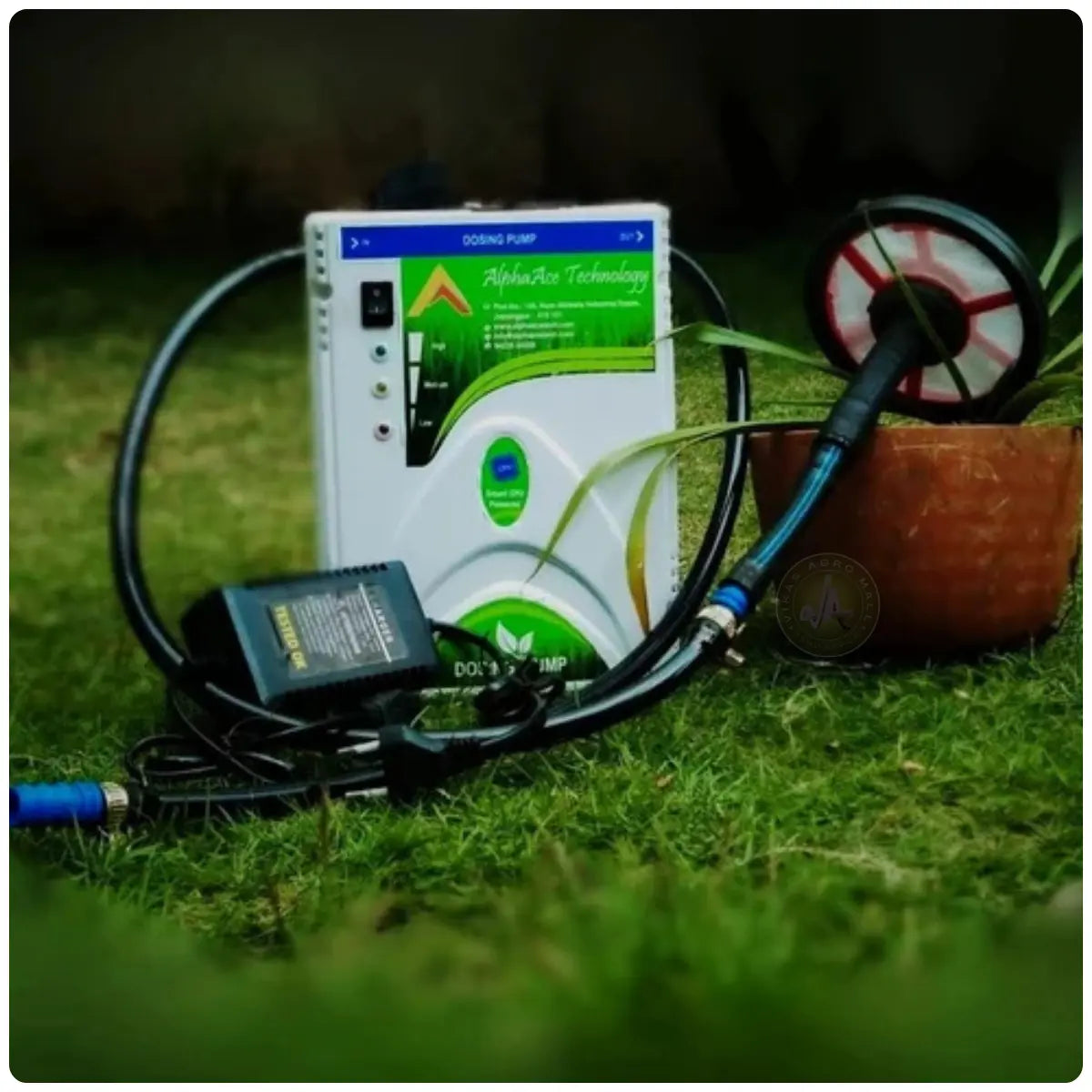 Alpha Marvel water soluble fertilizer injection pump on grass with a blurred background