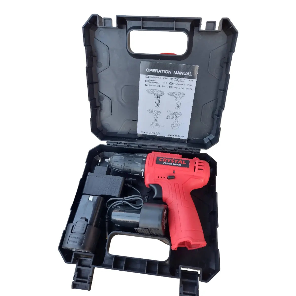 Red power drill with battery and charger in a black carrying case on a white background