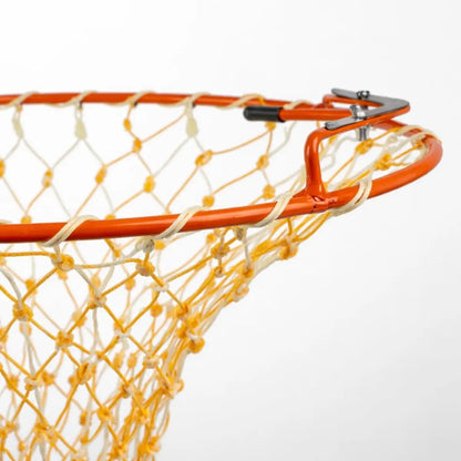 Orange and yellow mango harvester net with the blade on focus on a white background