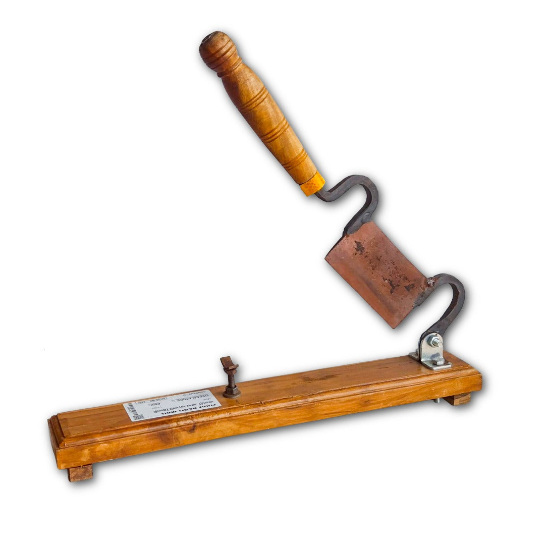 Wooden Mango cutter vili open blade on a white background