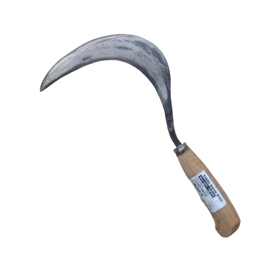 Sickle with wooden handle on a white background
