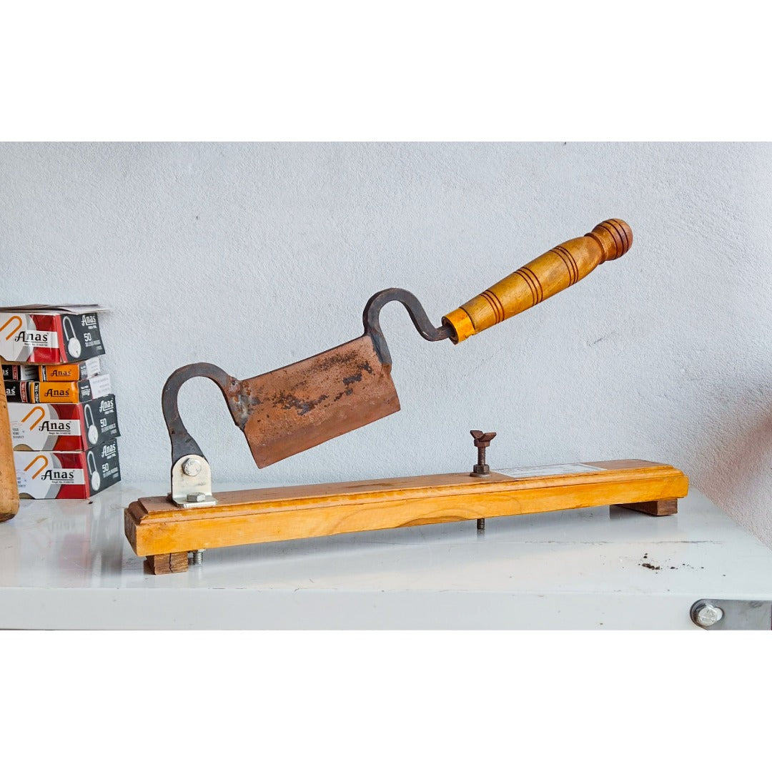 Vintage-style Mango Cutter for Pickle making against a light gray background