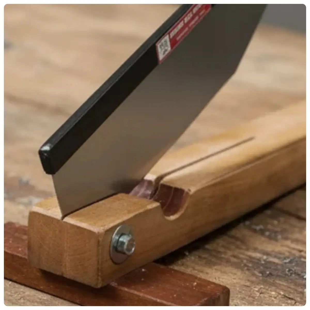 sugacane bud cutting machine with metal blade on a wooden surface