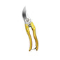 Gold-handled pruning shears on a white background