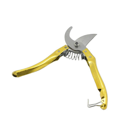 Gold-handled pruning shears on a white background
