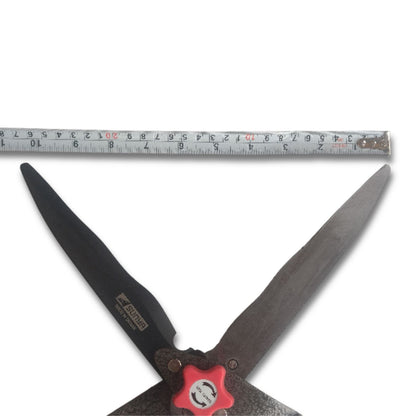 Shears with a ruler showing measurement on a white background