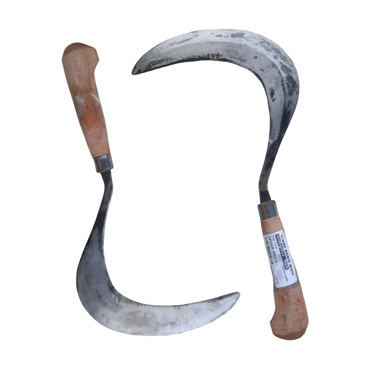 Two sickles with wooden handles on a white background